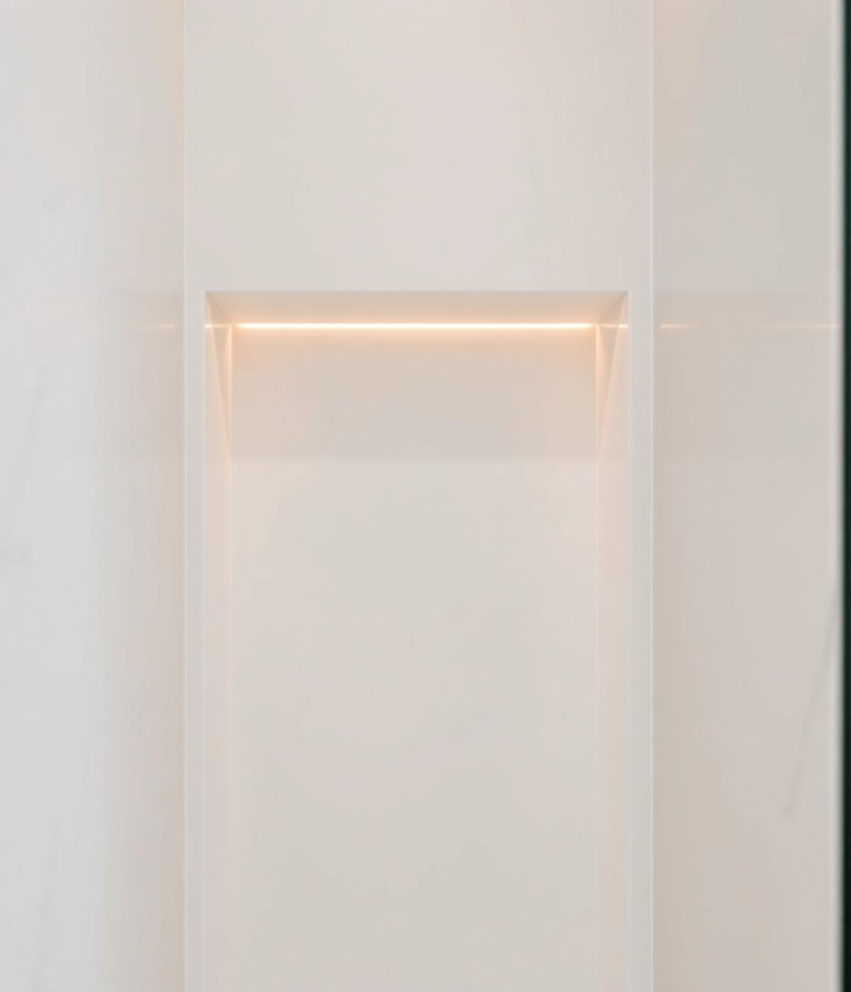Minimalistische badkamer-nis in acrylsteen met subtiele verlichting